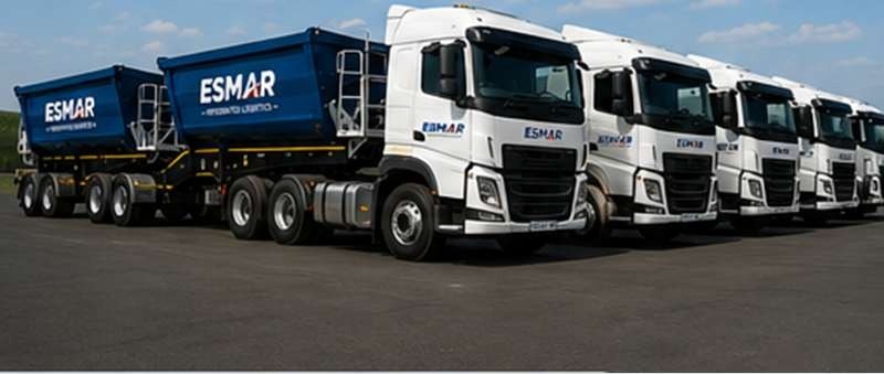 Row of ESMAR-branded side tipper trucks
